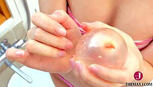 chiaki narumi pops water balloons in micro bikini