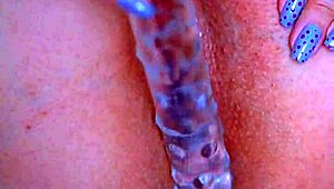 Watch that puffy pussy take a glass dildo!