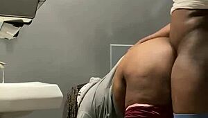 Milf gets backshots in bar bathroom