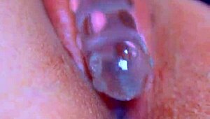 Watch that puffy pussy take a glass dildo!