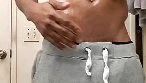 i rub oil on my big black cock after shower masturbation