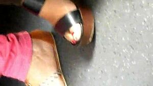 Mature feet candidly shown in wedges and sandals