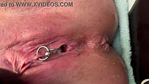 Woman Rubs Pierced Area With Gloves And Experiences Strong Urination