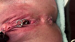 Woman Rubs Pierced Area With Gloves And Experiences Strong Urination