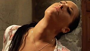 the sensual lesbian madame kisses and fingers her blindfolded slave in a bdsm scene