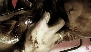 A naughty brunette and her man play with dark oil and fuck doggy style?