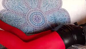 the milf shows off beautiful legs in red pantyhose and black heels