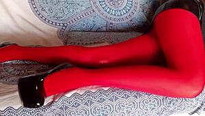 the milf shows off beautiful legs in red pantyhose and black heels