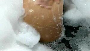 hot brunette gaucha masturbates in motel bathtub with giant dildo orgasm