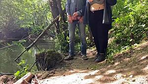 This mature mother-in-law gives an amazing handjob outdoors