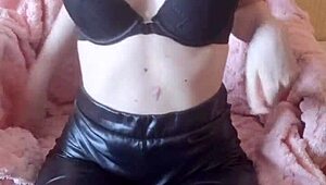 Bold ebony whore fingers her pussy while bound in bondage