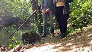 This mature mother-in-law gives an amazing handjob outdoors