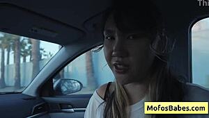 sexy asian hottie plays with natural big boobs in car