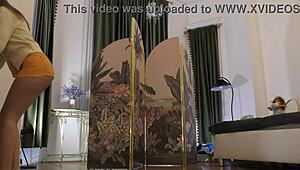 Beautiful brunette tries on sexy lingerie backstage