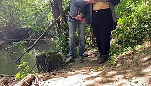 This mature mother-in-law gives an amazing handjob outdoors