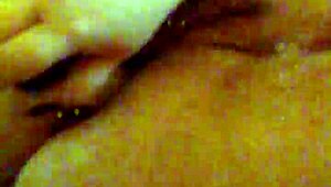 Mzslippery teases with her shaved pussy in front of the mirror