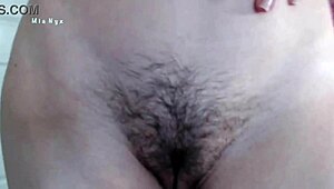 I tease my bushy pussy lips and panties as a natural babe