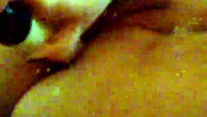 Mzslippery teases with her shaved pussy in front of the mirror