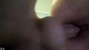 In this casual home scene, the husband makes his wife's wet pussy squirt.