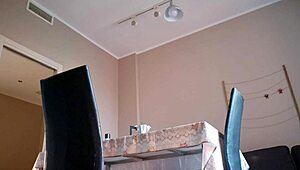 What is the hot woman doing in the kitchen in lingerie?