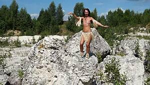 Topless dance in white stone quarry?