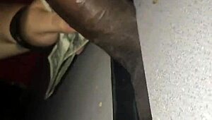 Homemade bbw amateur slut performs sloppy blowjob at gloryhole. She swallows cum from big black cock.