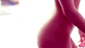 hot blonde playboy babe strips and teases