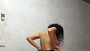 Hidden cam captures Colombian university babe undressing, her perfect body and big tits on display.