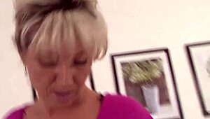 Horny mom takes off her thong and fills her hairy pussy with dong. She gags and chokes on it deeply.