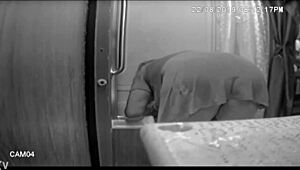 jennifer bent over washing the shower