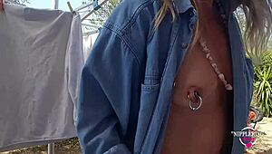 i love this kinky milf mommy playing with her pierced pussy and nipples outdoors