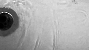 Sexy brunette enjoys a relaxing shower bath