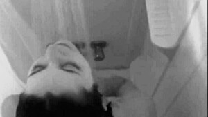 Sexy brunette enjoys a relaxing shower bath