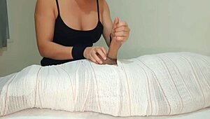 Part two of mummified handjob interrupted by cum