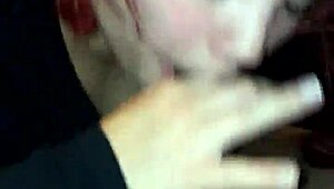 sexy redhead giving a blowjob