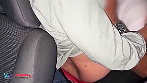 The husband watches his wife mingle at the group gathering in the car