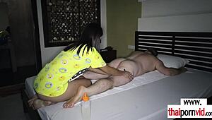 Amateur Thai teen massages fat client's hard dick. 😉