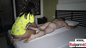 Amateur Thai teen massages fat client's hard dick. 😉