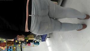 i am filming this chubby girl at the supermarket, she is walking the aisles and picking groceries