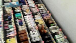 i am filming this chubby girl at the supermarket, she is walking the aisles and picking groceries