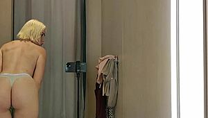 blonde tries on transparent latex outfits in public dressing room