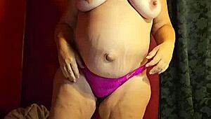 The pregnant wife is wet and ready to strip, ripping off her clothes and thong.