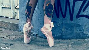 Ballerina struts down the street in ballet shoes, barefoot and dancing. 💃