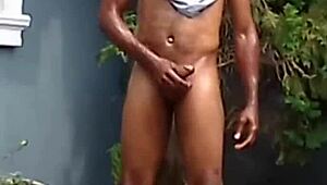 hey, that african horny man sunbathing in the compound beating his meat and touching his ass