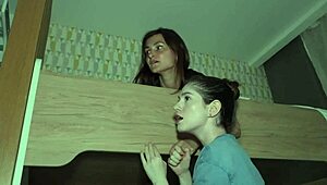 The two sisters hide and watch as their parents make love intensely