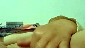 abuela playing with her big carrot in the bedroom