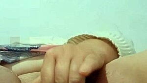 abuela playing with her big carrot in the bedroom