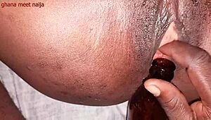 Ghana ebony onion booty slams malt bottle deep in ass