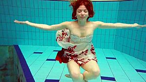 hot teen marketa dives underwater in bikini at beach