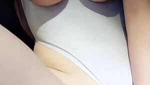 china's cutest babe caresses her big perky tits sensually